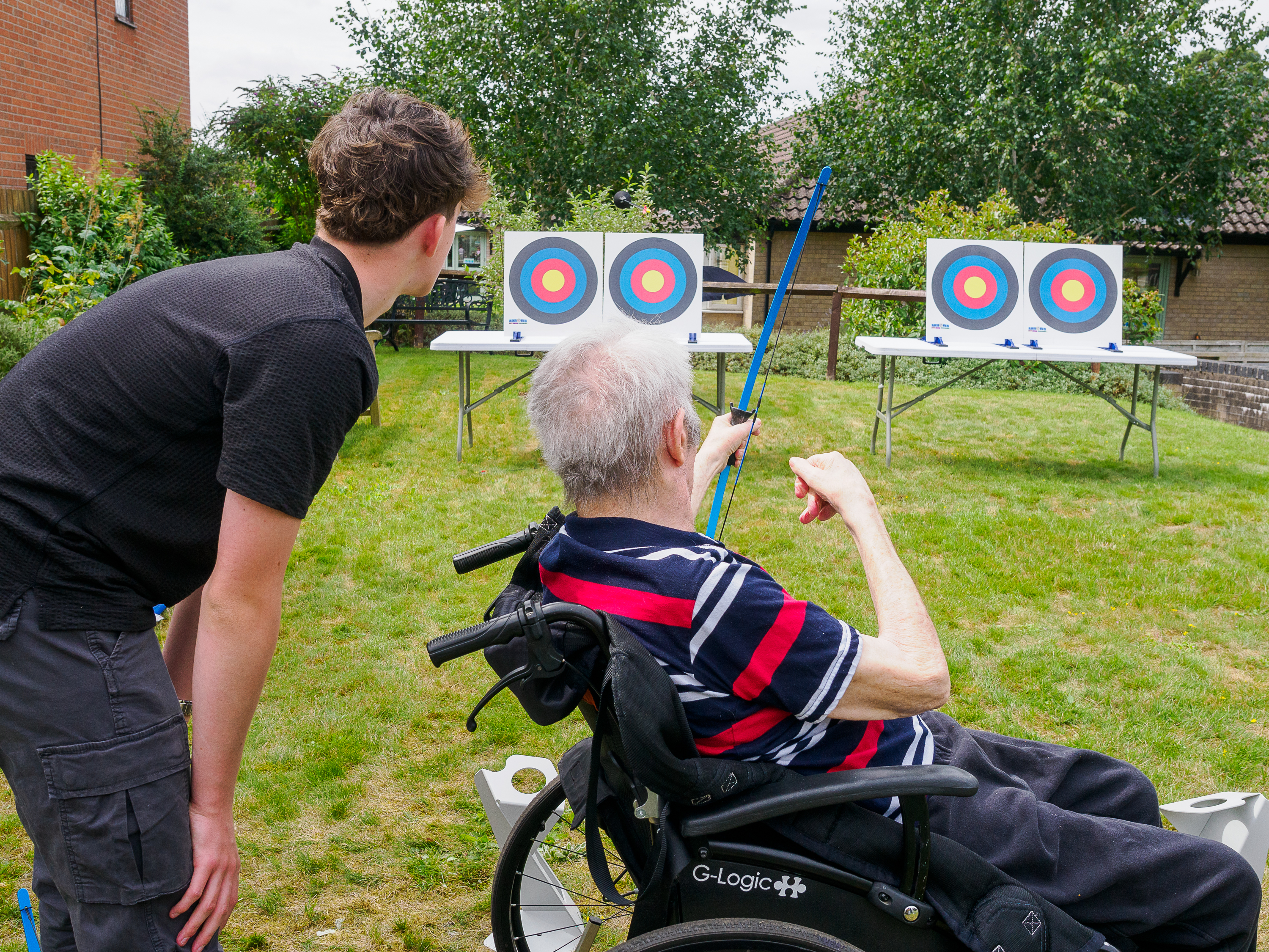 Archer and young leader at soft archery event